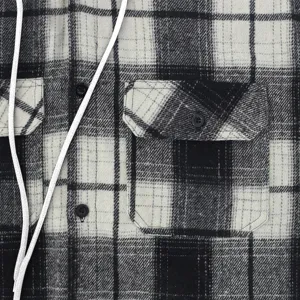 Men black white plaid flannel hooded shirt detail showing soft fabric and double chest pockets.