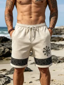 Men's beach shorts detail, beige faux linen fabric, black Viking rune print, drawstring waist.
