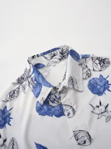 Close up view of men's hawaiian shirt collar with blue floral print and size tag detail