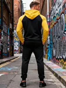 Men color block fleece hooded tracksuit lifestyle detail shot in urban street graffiti setting