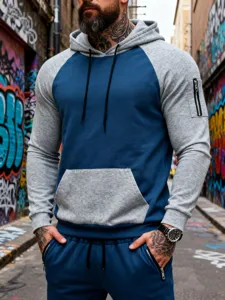 Detailed view of men's colorblock hooded sweatshirt and sweatpants set for casual wear.