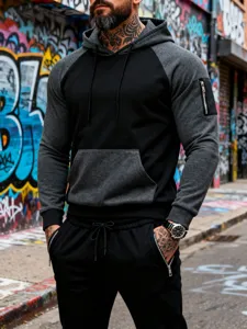Men's color-block hooded sweatshirt and pants tracksuit detail, stylish streetwear set.