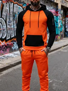 Men's colorblock fleece hooded tracksuit detail, orange and black streetwear set.
