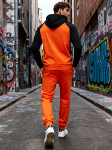 Men's fleece-lined colorblock tracksuit with hoodie and pants shown in street detail view.
