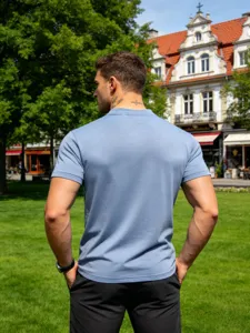Detail view of the casual men's short sleeve top in light blue, outdoor street style shot.