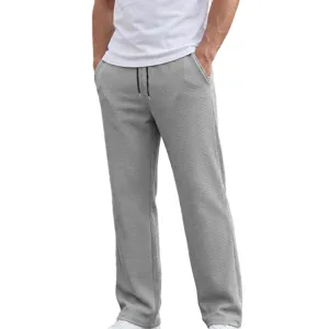 Dettaglio texture maglia waffle pantaloni dritti casual da uomo con coulisse in vita.