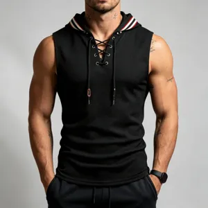 Close-up detail of mens black waffle knit sleeveless hoodie with contrast stripe hood and lace-up.