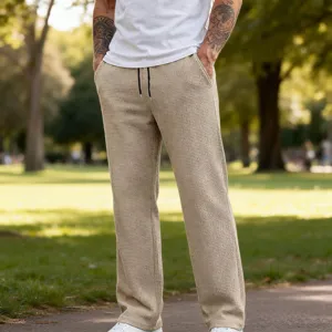 Pantaloni casual dritti slim da uomo in tessuto waffle con coulisse in vita per primavera autunno.