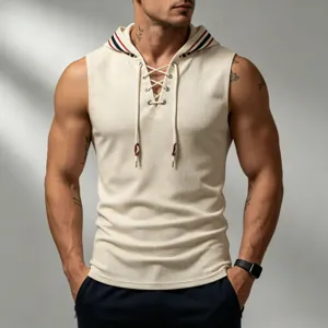 Men's waffle knit sleeveless hoodie with contrast stripe hood and lace-up front detail.