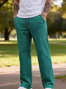 Pantaloni casual da uomo in maglia waffle tinta unita gamba dritta con cordoncino in vista.