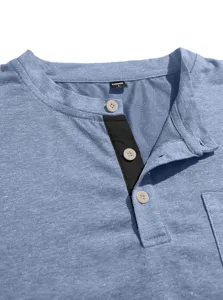 Close-up detail of men casual henley shirt collar, buttons and black placket accent.