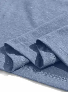 Close-up of blue men's t-shirt hem fabric and fine stitching detail for quality check.