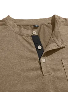 Close up view of men's casual brown Henley t-shirt collar and button placket detail