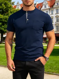 Close-up view of the men's dark blue henley t-shirt featuring a buttoned placket and chest pocket.