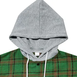 Detailed view of grey hoodie with green plaid flannel fabric and white drawstrings.