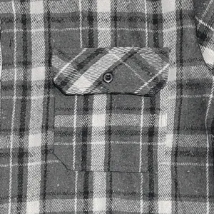 Detailed shot of men vintage flannel plaid shirt chest pocket textured fabric design