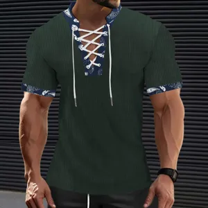 Close up detail of men's corduroy short sleeve V-neck tee with lace-up and paisley trim.