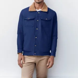 Men's blue cotton worker jacket with brown sherpa collar and metal button closure detail.