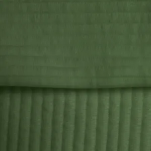Close-up view of the green ribbed jacquard fabric texture, showing soft material and detailed knit.