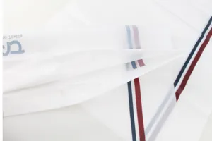 White frosted plastic packaging bag with red and blue stripes, durable die-cut handle design for towels.