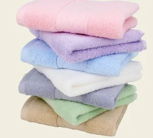 Soft 100% cotton face towels in various pastel colors featuring diamond satin border design.