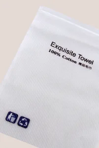 Detail shot of the frosted vertical striped plastic towel packaging bag with zip lock.