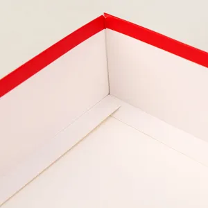 Detailed close-up view of the interior corner and folding craftsmanship of a red gift box.