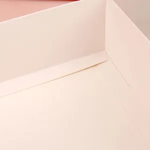 Detailed view of the pink gift box interior, highlighting premium paper texture and clean folding.