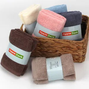 Soft cotton face towel set in 6 assorted colors rolled neatly inside a wicker basket.
