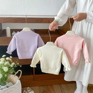 Sweet knit sweater for baby girls, featuring round neck and cute ruffled long sleeves.