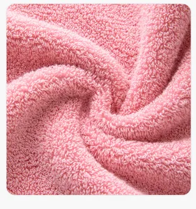 Close-up detail of soft pink cotton towel fabric texture, pure cotton facial hand cloth.