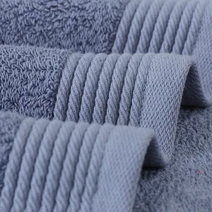 High quality grey cotton bath towel with soft loop texture and absorbent fabric design.