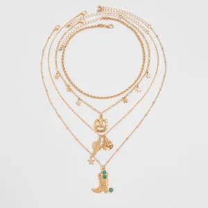 Bohemian gold-tone layered necklace set featuring western cowboy boot and star charms