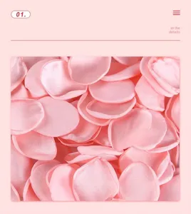 Close-up macro shot of pink satin artificial rose petals showing detailed fabric texture