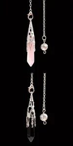 Close-up detail of natural rose quartz and black obsidian crystal dowsing pendulums