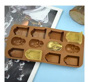 Close-up of Halloween silicone mold with skull and tombstone shapes for DIY resin crafts