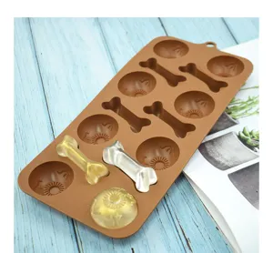 Detailed close-up showing a brown bone and sun-shaped silicone mold with resin samples