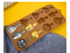 Detailed view of Halloween skull potion bottle silicone mold with gold finished casts
