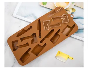 Detailed close-up of brown silicone mold with axe and knife shapes for DIY resin