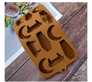 Detailed view of brown Halloween silicone mold featuring coffin, moon, and vampire fang shapes