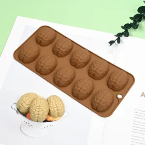 Detail view of brain-shaped silicone mold showing intricate texture of finished candies.