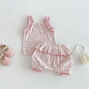 Detailed view of baby girl summer floral sleeveless top and bloomers set with cute ruffles.