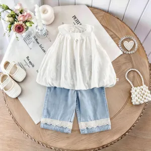 Toddler girls summer outfit set with white sleeveless dotted blouse and lace trim denim shorts.