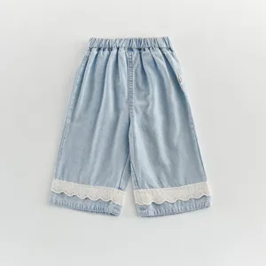 Toddler girls summer light denim shorts with cute white lace hem and elastic waist detail.
