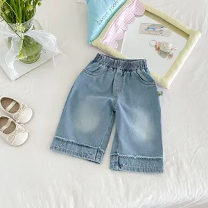 Kids denim wide leg pants featuring cute heart embroidery details at cuffs for girls.