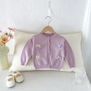 Baby girl knit cardigan sweater with cute heart embroidery and bows for autumn daily wear.