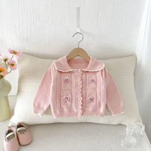 Toddler girl pink knit cardigan with bow details, sweet doll collar and button closure.