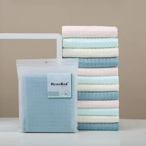 Ensemble de serviettes gaufrées en coton doux, serviettes de bain absorbantes de diverses couleurs.