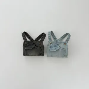 Close-up detail of infant denim overalls, foldable baby clothes with pockets, soft fabric texture.