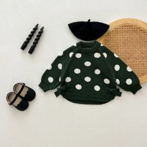 Toddler girl dark green knitted sweater with cute white polka dots and side bows for autumn.